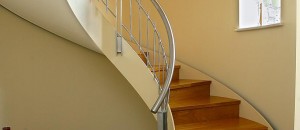 Closed rise curved staircase from Signature Stairs